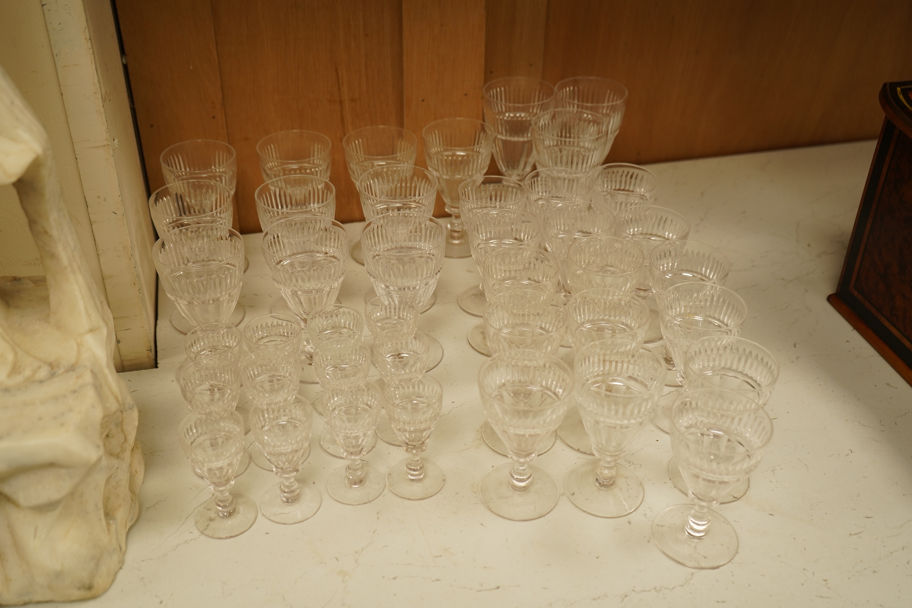 A part suite of 19th century cut glass drinking glasses, largest 13cm high